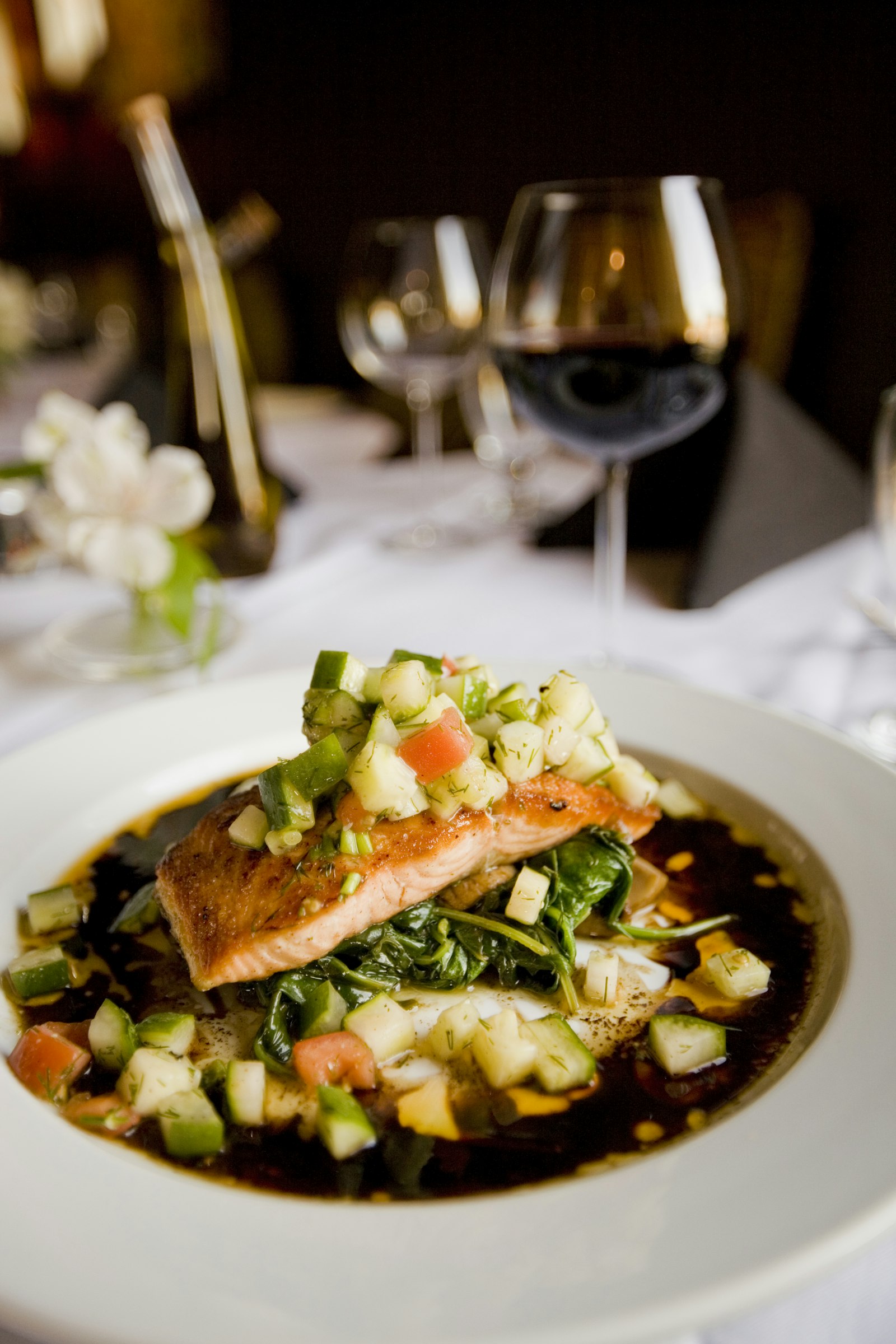 Pan-seared salmon with seasonal vegetables and red wine