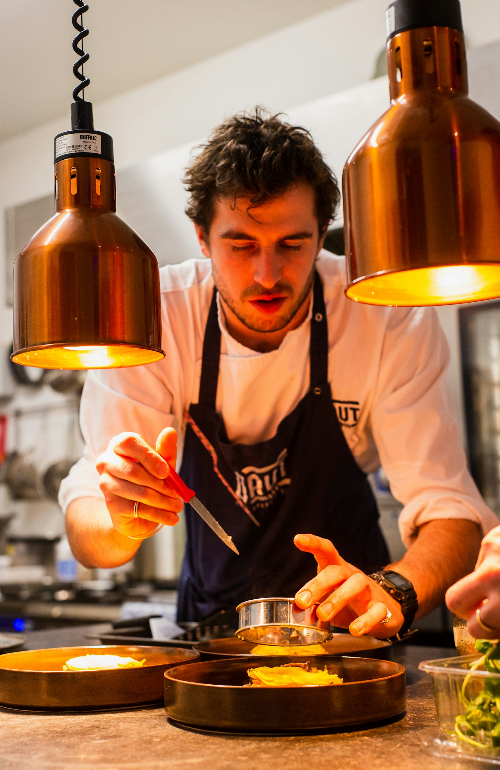 Head chef preparing a dish in the kitchen